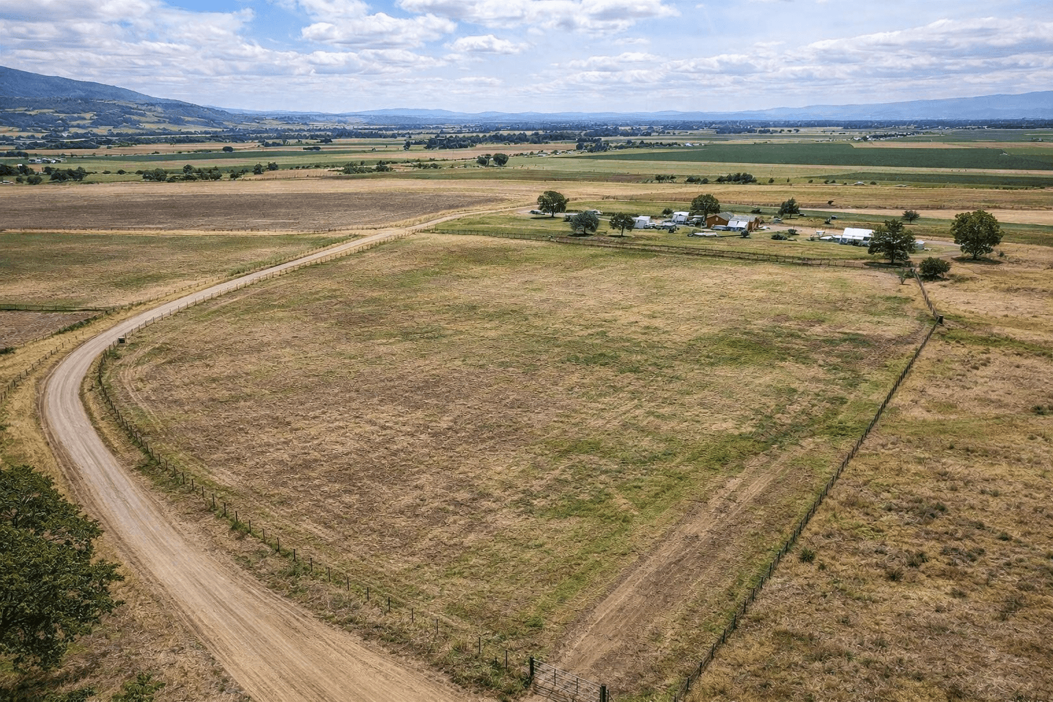 Original aerial photo of open acreage before an AI land-use concept.