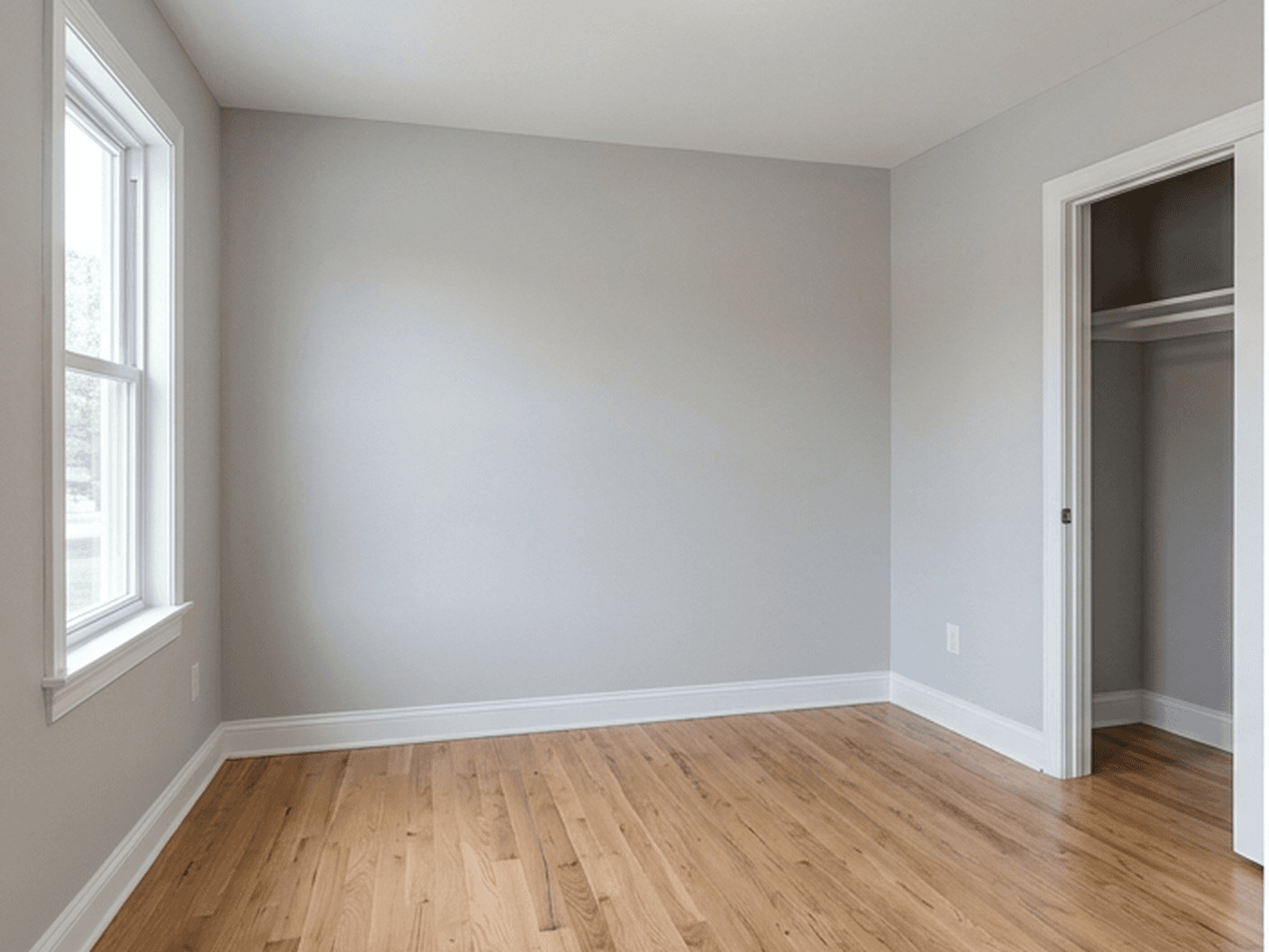 Before AI staging: empty bedroom with window and closet