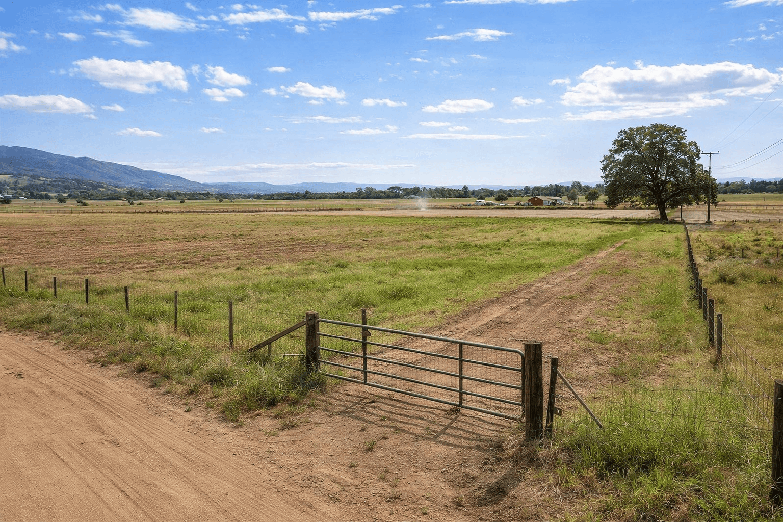 Original vacant rural acreage photo before an AI cabin concept was added.